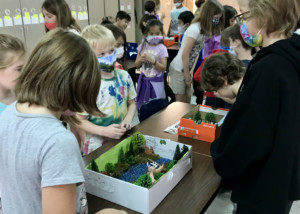 Fourth Grade students share their biome projects with our first grade friends